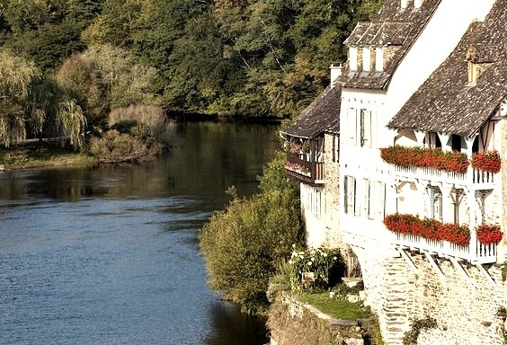 Beautiful houses on the shores of Dordogne river in Argentat, France